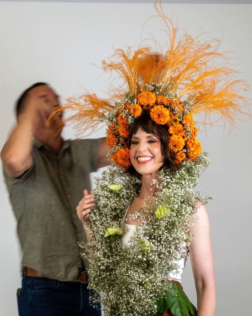 Styling model with a floral headpiece and shawl for a photo shoot