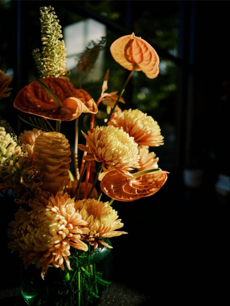 Peach floral arrangement with anthurium, ginger and grevillea in a private residence